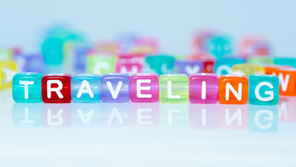 the word traveling in colorful blocks. words in colorful cubes. concept about traveling, vacation