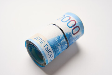 Russian money roll ruble on a white background