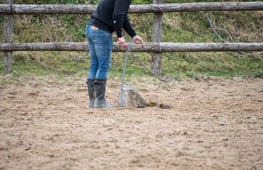 Stable  year  gore  hand  clean  up rose s  muck  i the  arena 
