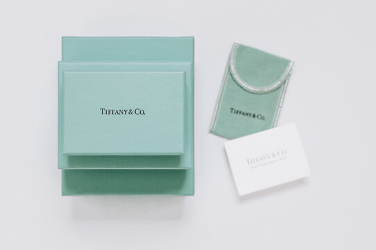 Pyramid of Tiffany's branded boxes, a fabric cover for decoration and a card.