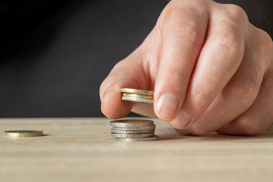 Hand hold euro coin moeny. Home budget concept. Financial pattern