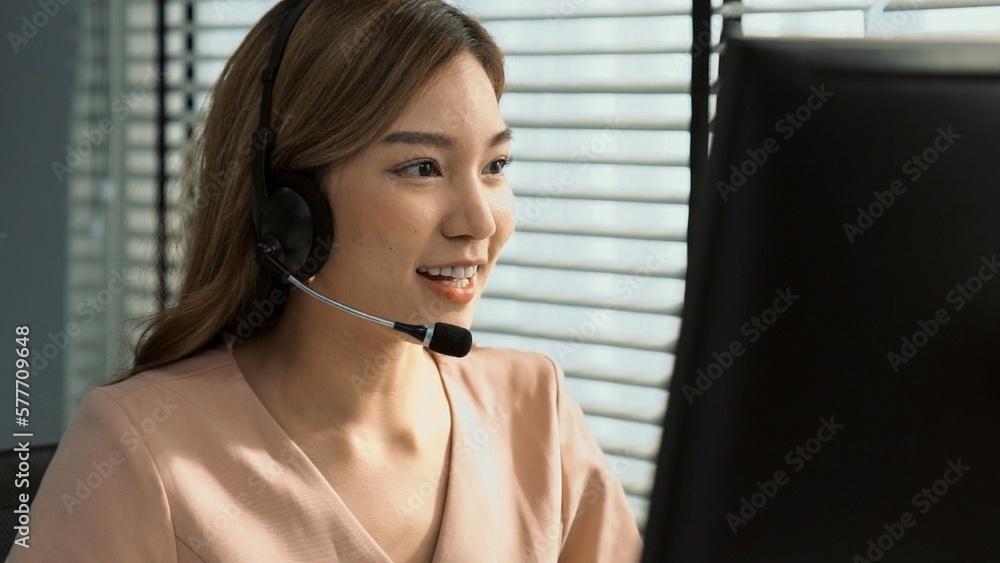 Aufkleber competent female operator working on computer and while talking with clients. concept relevant to bo