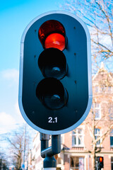 Traffic light against blue sky background 