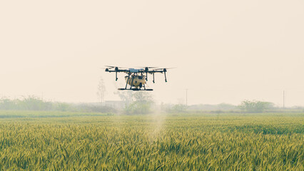 Agricultural Drone spraying water on the feild