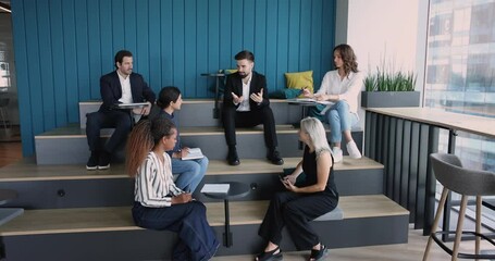 Opinion exchange, corporate meeting, educational seminar training of staff. Businessman, team leader make speech, explain strategy, talk to colleagues attend group meeting in modern co-working office