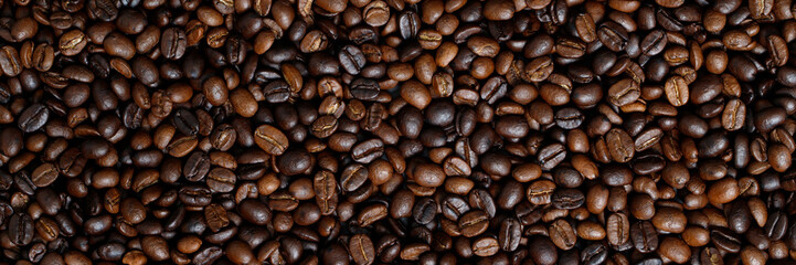 photo macro close up texture of roasted coffee beans dark, can be used as a background.