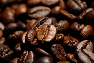 photo macro close up texture of roasted coffee beans dark, can be used as a background.