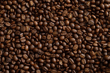 photo macro close up texture of roasted coffee beans dark, can be used as a background.