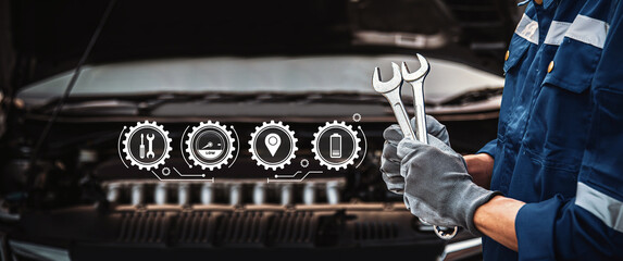 Car care maintenance and servicing, Close-up hand technician auto mechanic using the wrench to...