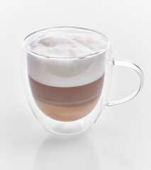  One cup of cappuccino coffee over white isolated background