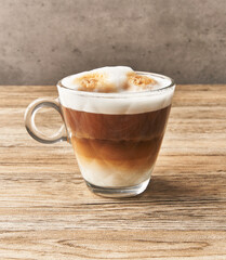  One cup of cappuccino coffee on wooden surface