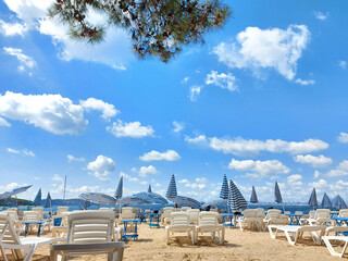 Sun loungers and umbrellas on a sandy beach