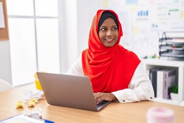 Young beautiful woman business worker using laptop working at office