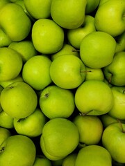 Green apples background. ecological Apples in the supermarket.