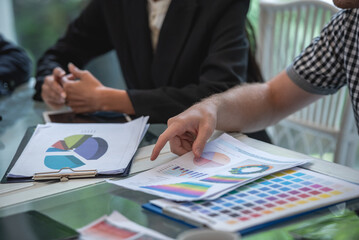 Hand and measuring tool Team work brainstorming many data analyst statistics drawing graph analytics diagram work paper for best solution to explaining Business feasibility, increase sales profit