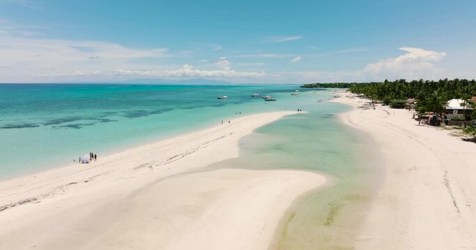 Aerial view of tropical sandy beach with palm trees. Bantayan island, Philippines.