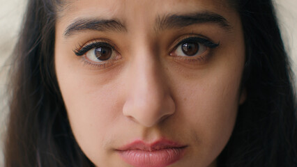Close up woman sad face with big eyes anxious upset frustrated young teen girl businesswoman feel...