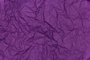 Purple crumpled paper background. Texture of crumpled paper