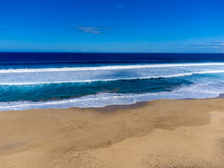 Difficult to access golden sandy Cofete beach hidden behind mountain range on Fuerteventura, Canary islands, Spain