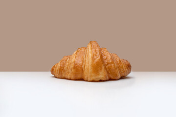 croissant on white and brown background