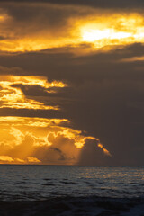 Landscape of dark sea at yellow sunset