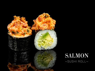 Close up to sushi roll pieces with mirror reflection on black background. Sushi roll with lettuce, cucumber and avocado, salmon on top. Ready menu advertising banner with text and copy space.