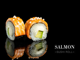 Close up to sushi roll pieces with mirror reflection on black background. Sushi roll with cream...