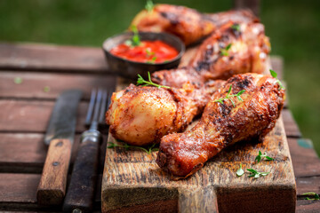 Tasty and spicy grilled chicken leg served with fresh sauce