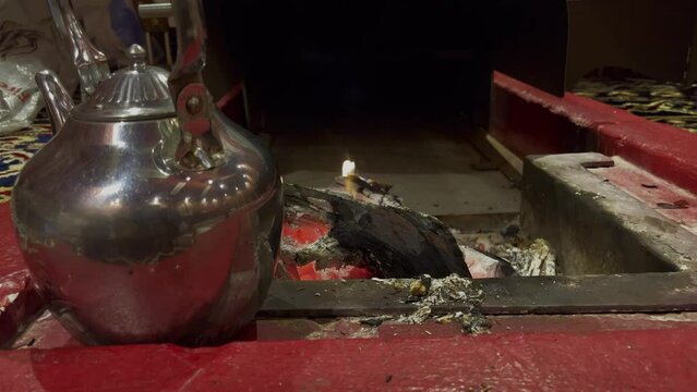 Fire in a tradition Saudi Arabian tent with sound of rain 