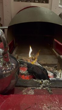 Fire in a tradition Saudi Arabian tent with sound of rain 