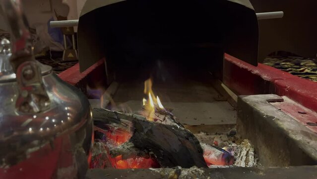 Fire in a tradition Saudi Arabian tent with sound of rain 