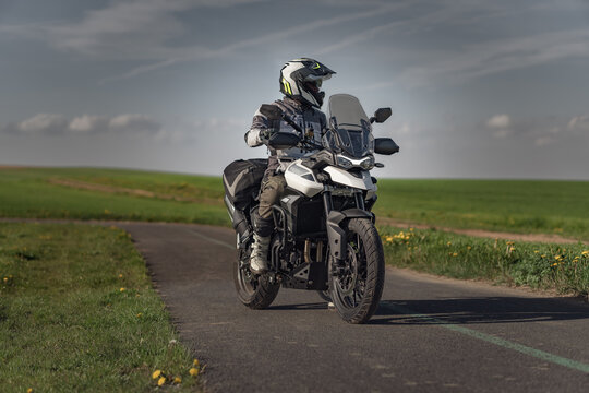 Landscape with motorcycle rider on the road