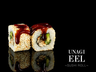 Close up to sushi roll pieces with mirror reflection on black background. roll with eel, cucumber,...