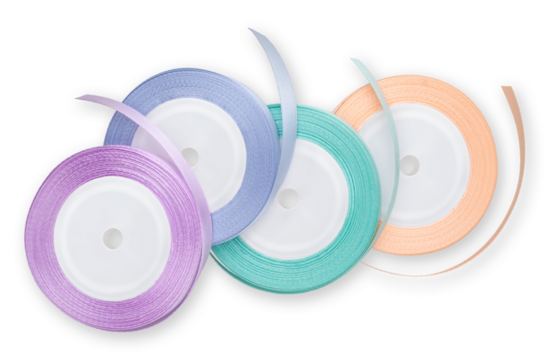 Rolls of satin ribbons for decorations and make shiny bows, embellished wrap package for festive, Easter, Christmas, wedding and birthday gift box. Isolated on white background