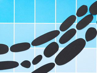 grungy, dirty black paper ovals on scrapbook paper sheet with paint-chip design (blue boxes)