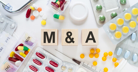 Wooden cube with the letter M and A. Medical background.