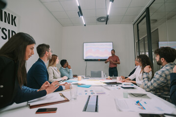 Business man presenting to his colleagues