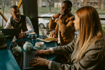 Business girl writing on laptop