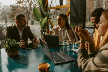 Colleagues talking at the cafe