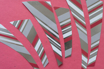 paper stripes with stripe pattern on rough pink paper