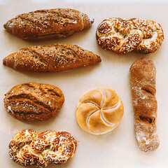 Assortment of baked bread on baking paper