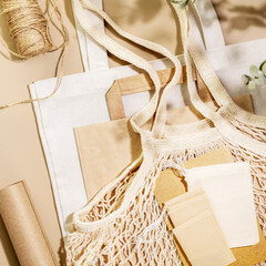 Eco friendly shopping, delivery service. Sustainable still life with textile bags, paper bag, mesh...