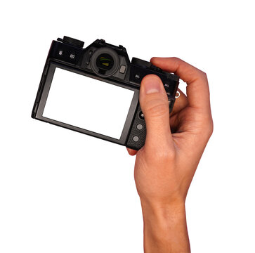 male hand holding mirrorless camera on transparent background mockup                          