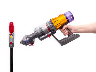 Woman's hand holds Modern cordless vacuum cleaner isolated on white background. New technologies.