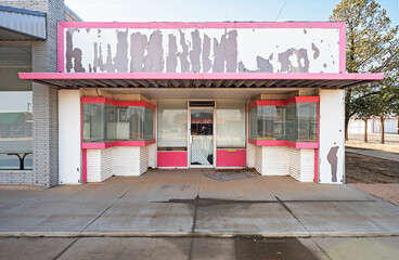 Display windows of an abandoned store in downtown Denver City, Texas, USA