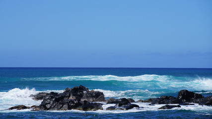 waves crashing on rocks