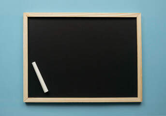 Empty chalkboard with chalk. Copy space.