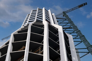 Bottom view of the construction of a new residential skyscraper