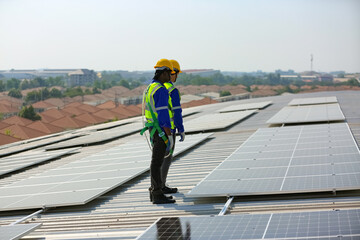 technician in work gloves installing stand-alone photovoltaic solar panel system under beautiful blue sky with clouds. Concept of alternative energy and power sustainable resources. 