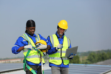 technician in work gloves installing stand-alone photovoltaic solar panel system under beautiful blue sky with clouds. Concept of alternative energy and power sustainable resources. 